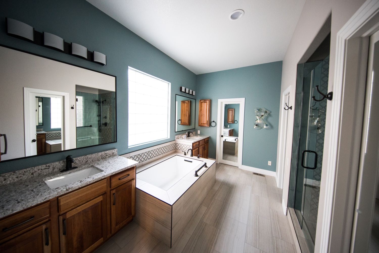 Renovated bathroom with vanity, mirror and fixtures