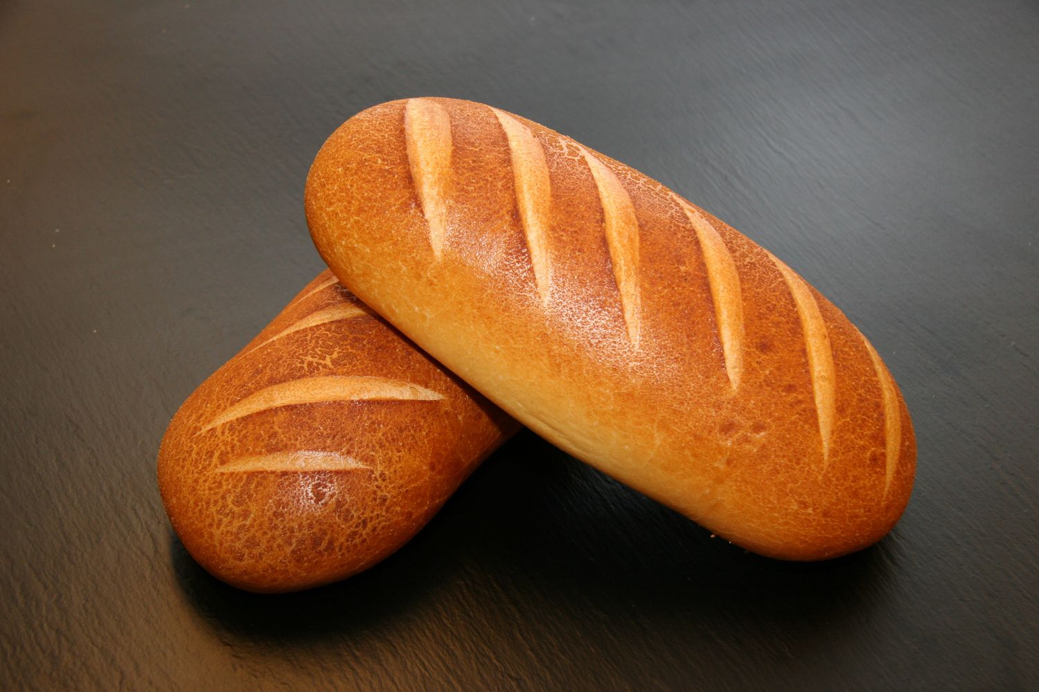 Fresh-baked loaves cooling, golden crust