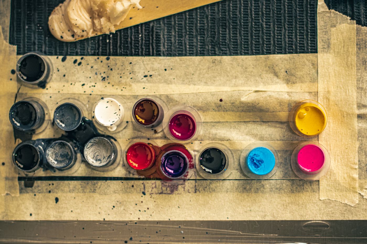 Caps of coloured tattoo ink from above