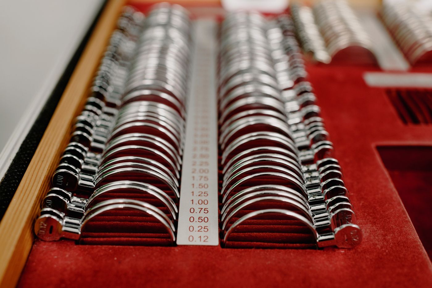 A trial lens set on red velvet