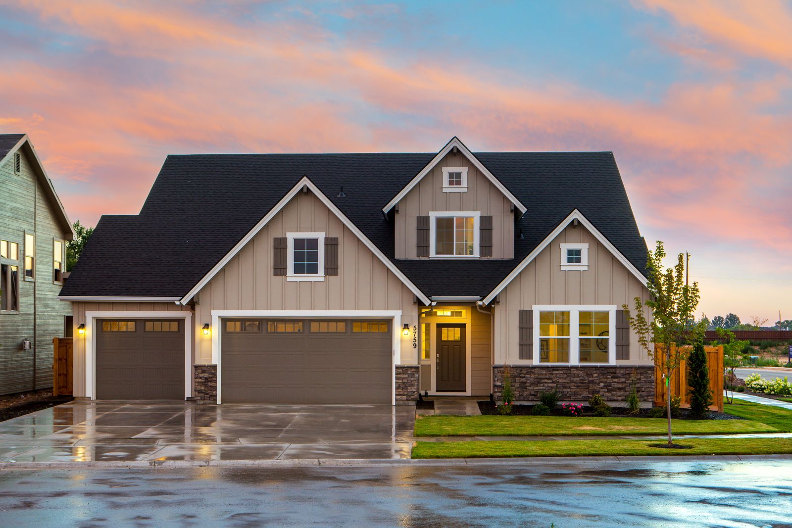 Clean home exterior with a finished roofline and driveway