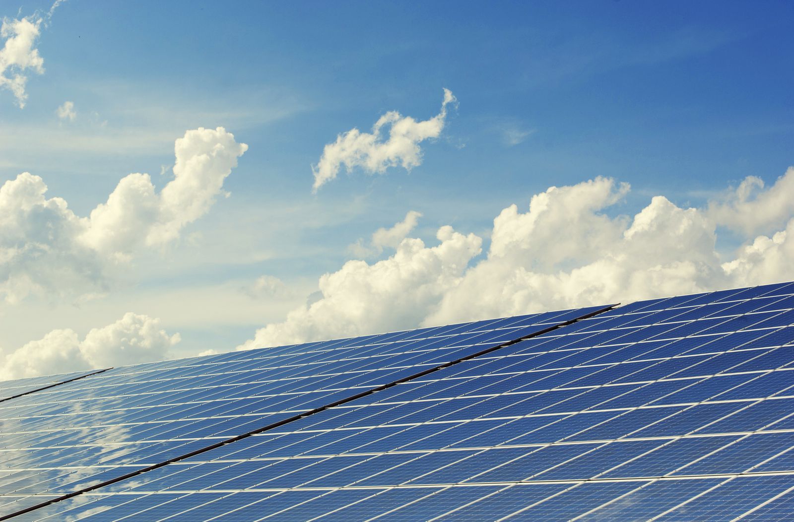 Solar panels against a clear sky, battery-ready