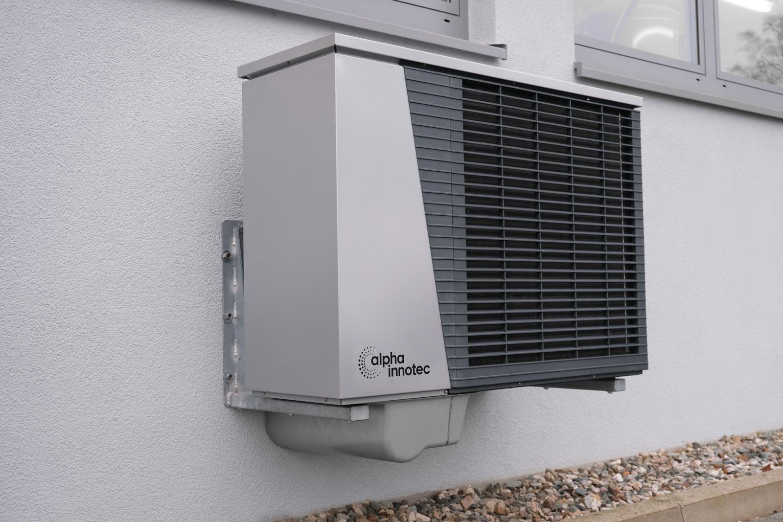 Outdoor condenser unit on a building exterior