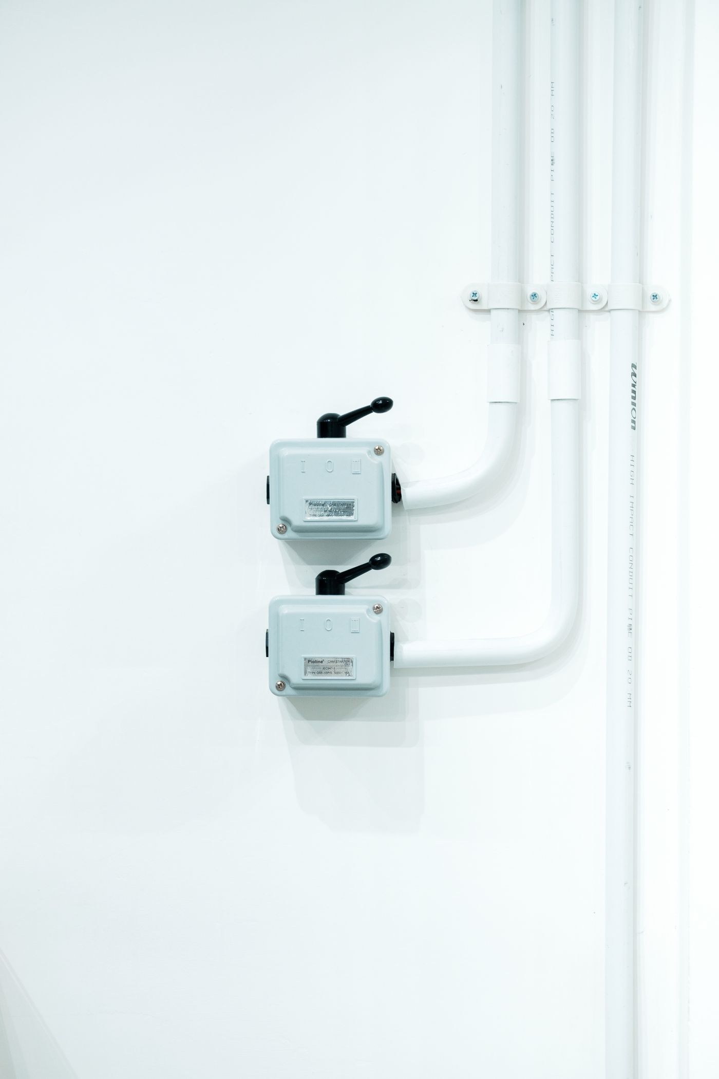 Clean modern light switches on a white wall