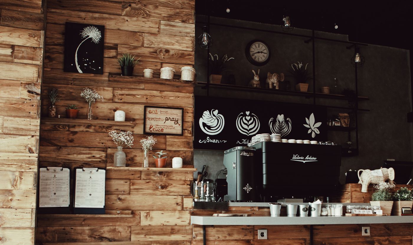 Warm cafe interior with shelves