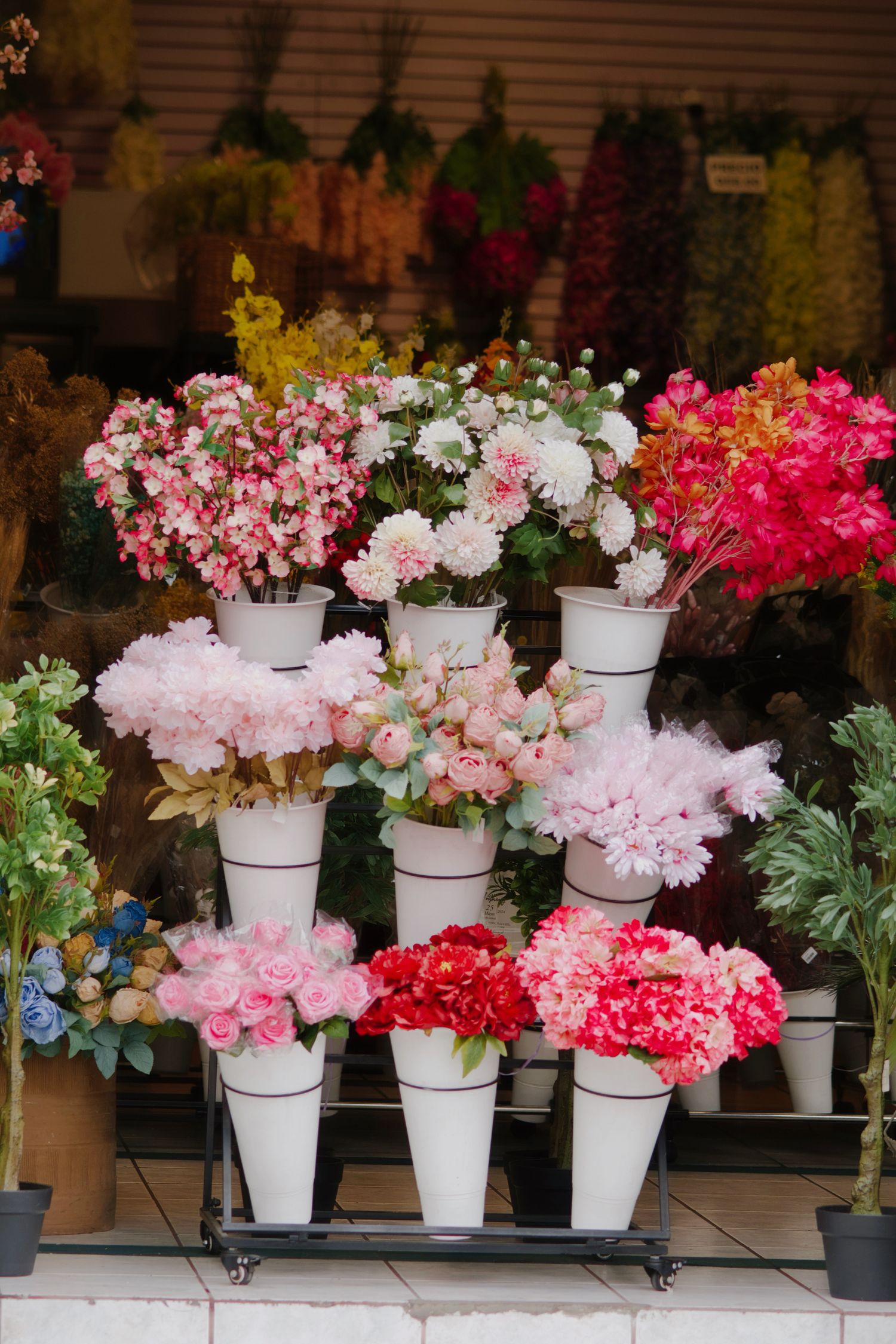 Buckets of fresh flowers at the entrance