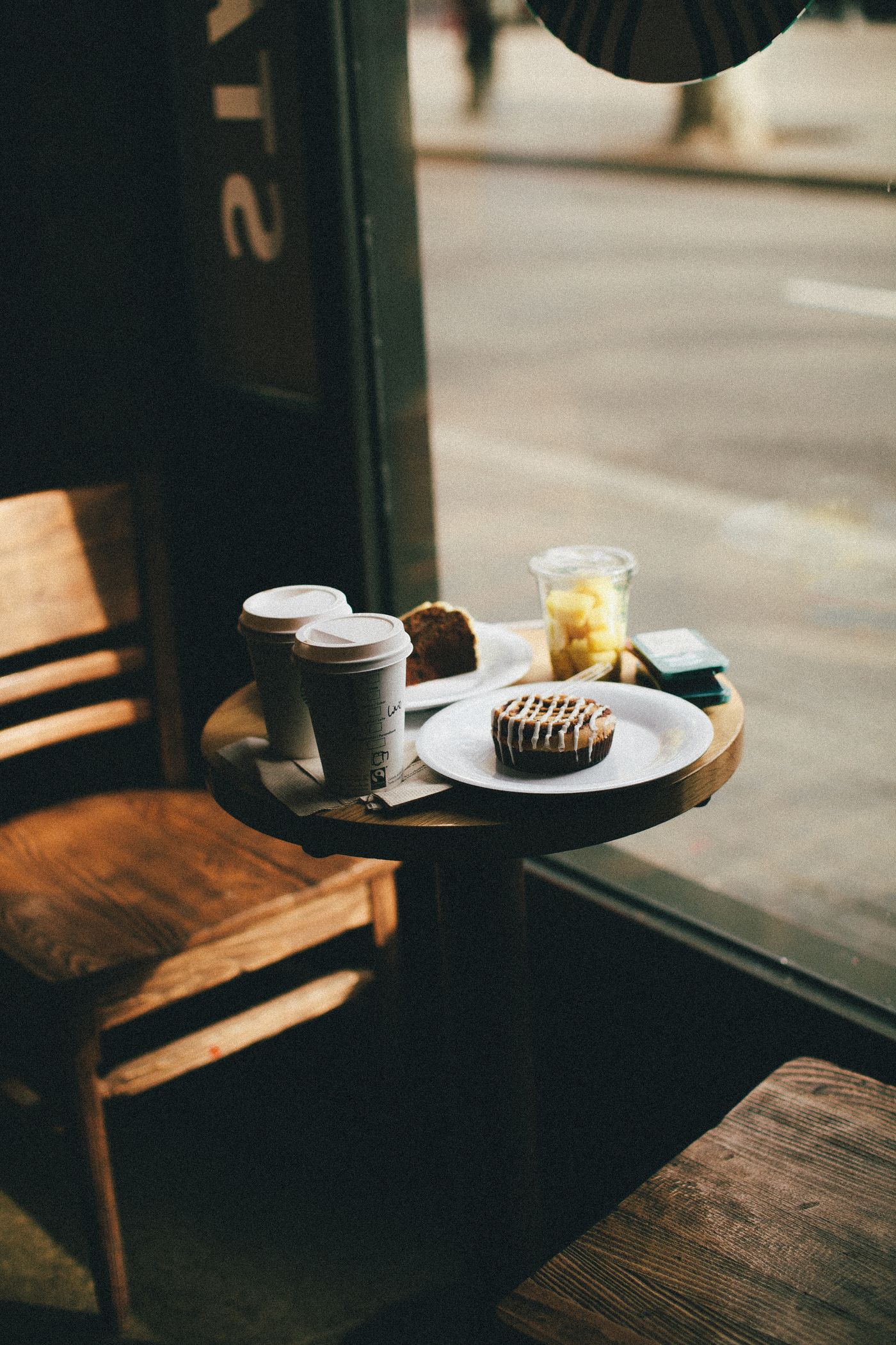 Cafe counter with coffee and pastries on a tray