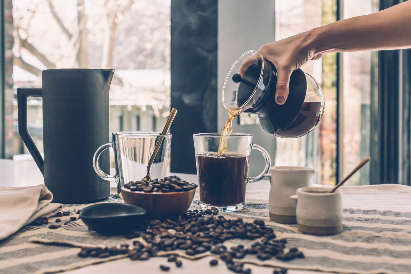 Pour-over coffee and espresso on a cafe table