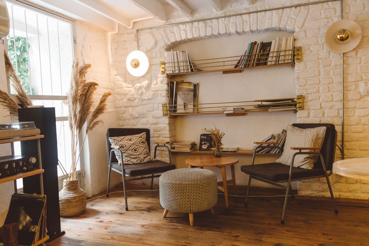 A warm, styled interior with shelves and soft seating