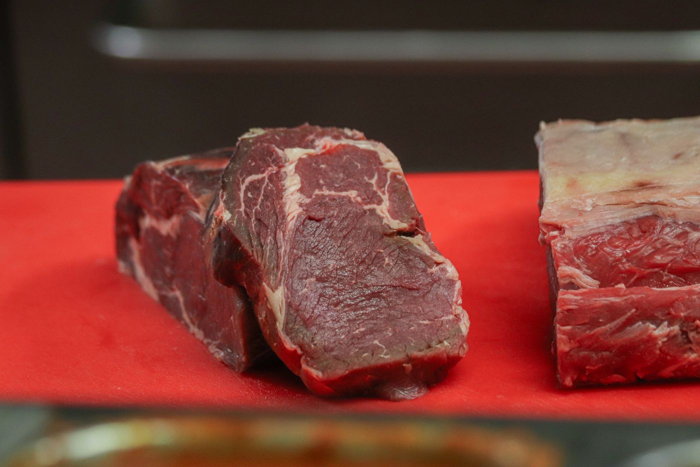Raw marbled beef cuts on a board