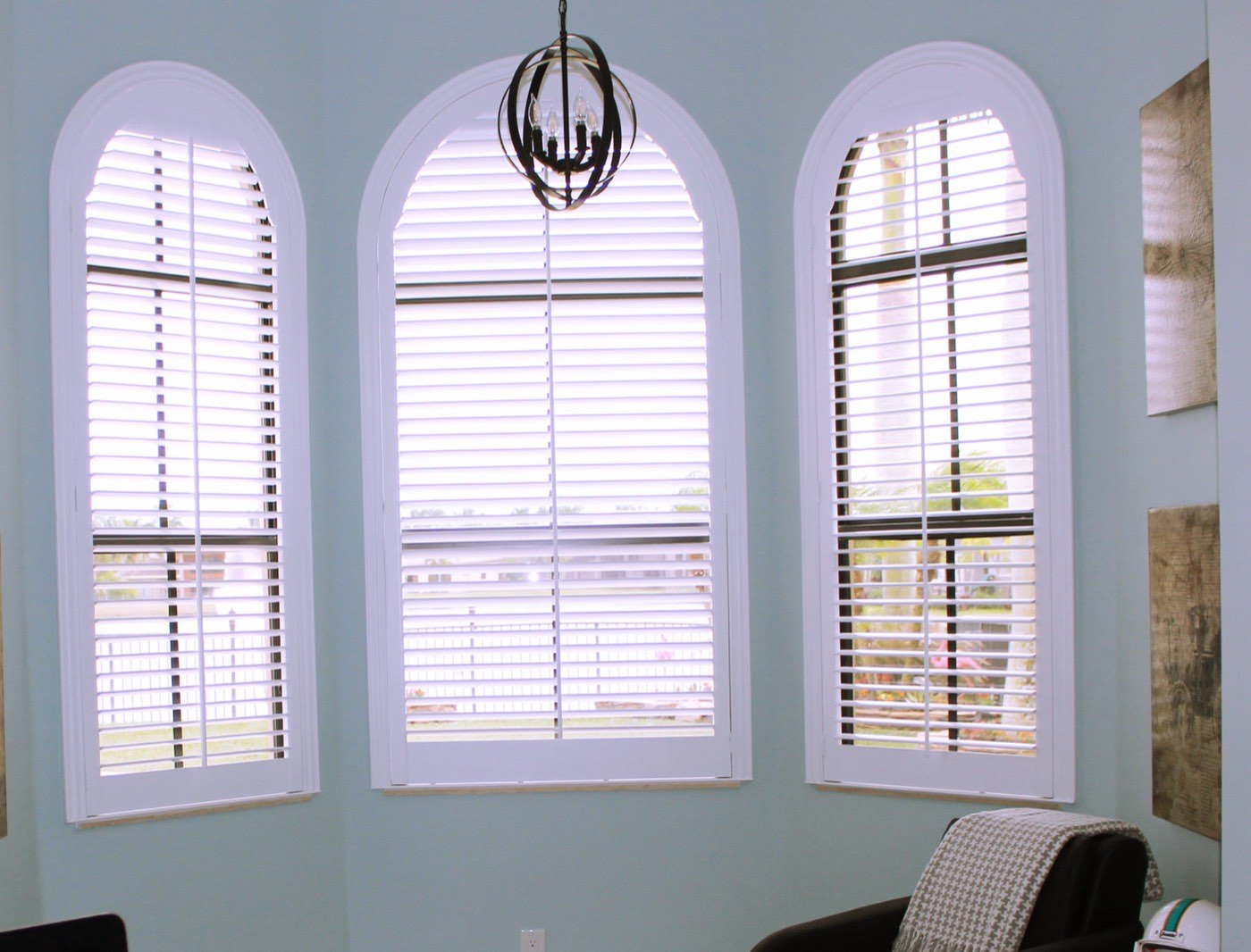 Plantation shutters on arched windows