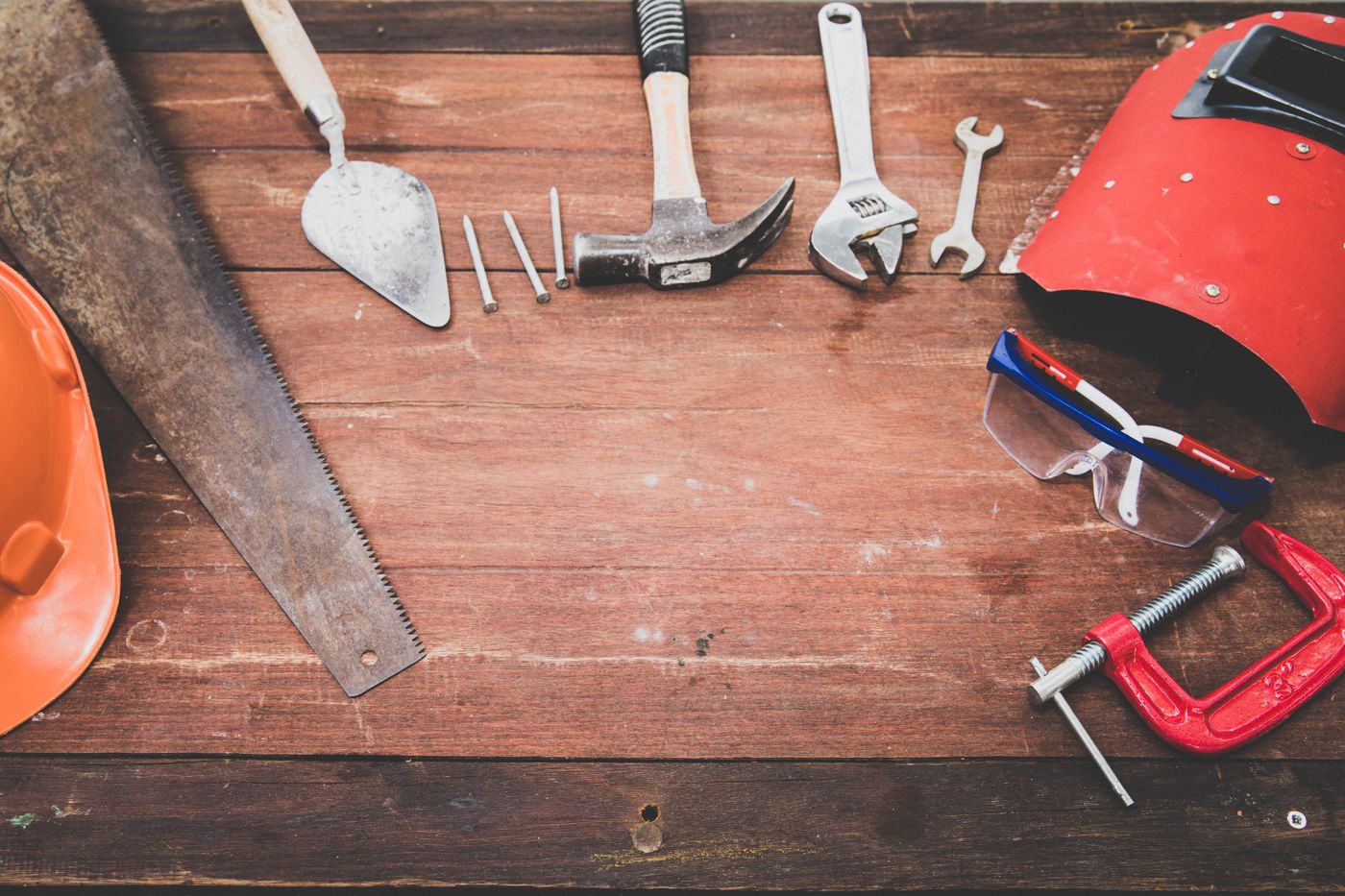A tidy set of hand tools laid out on a workbench