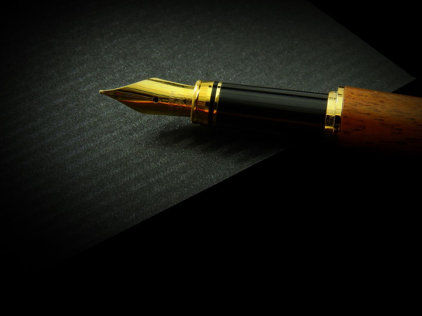 A fountain pen on an open notebook