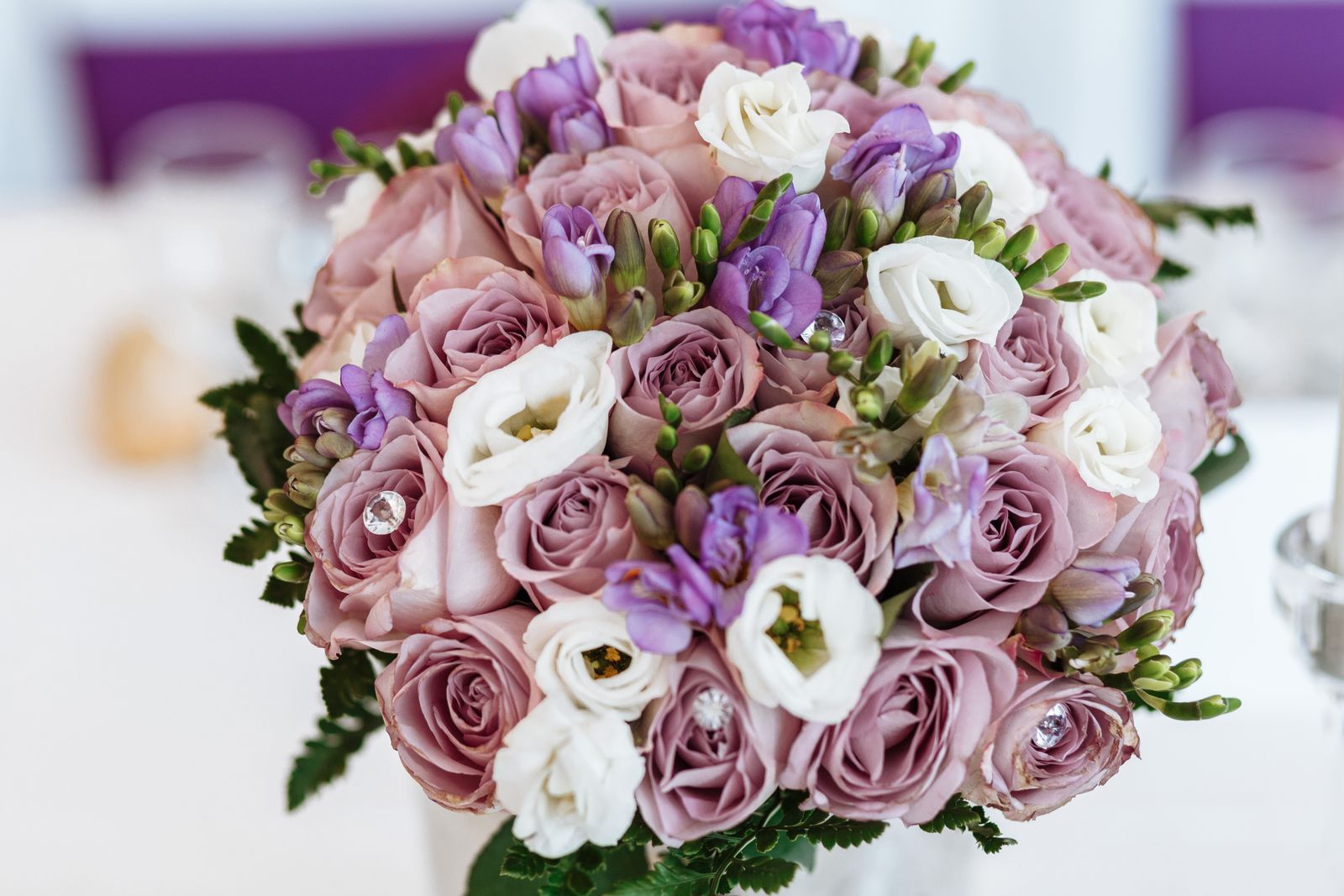 A soft lilac and white rose arrangement