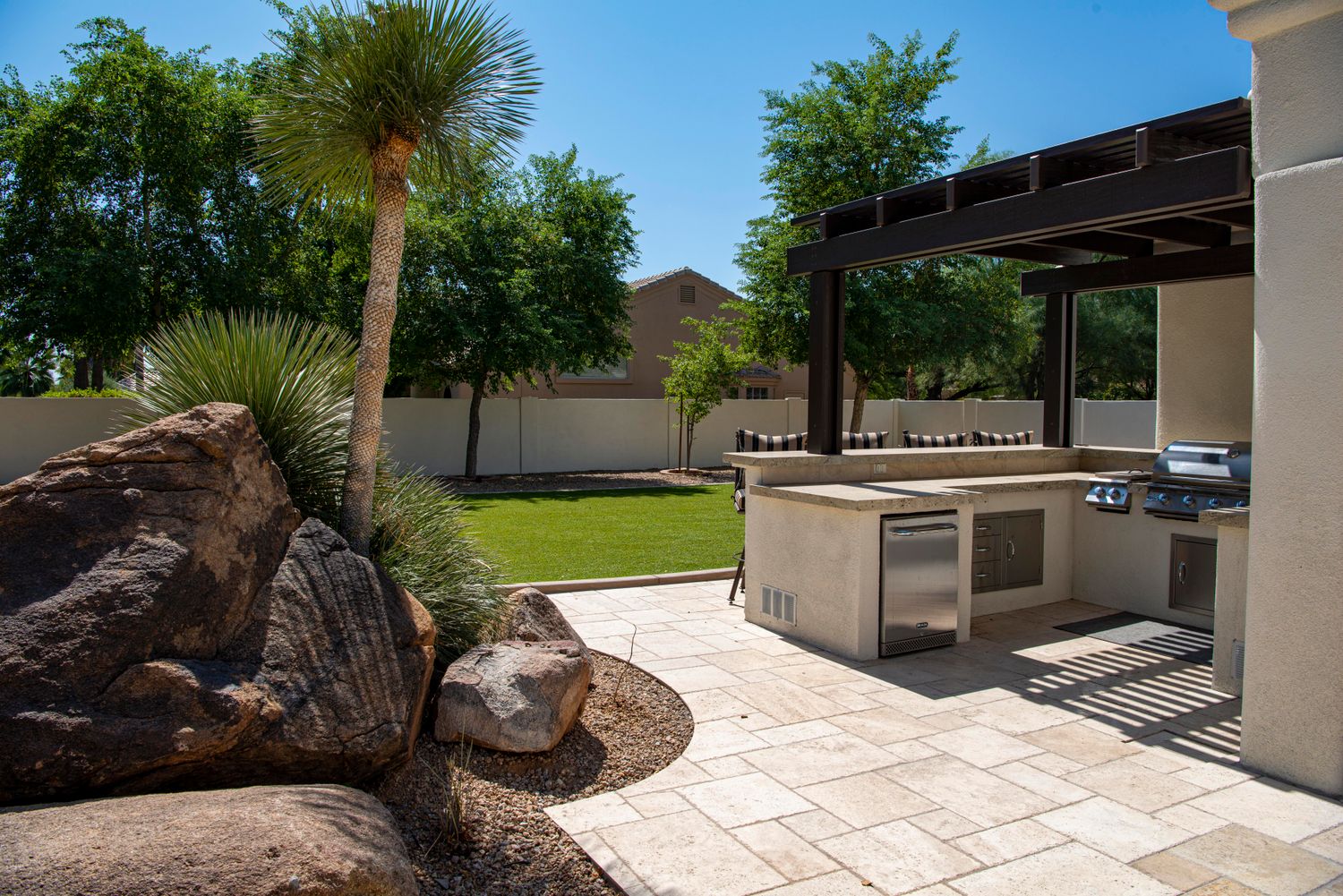 Finished paver patio with outdoor landscaping