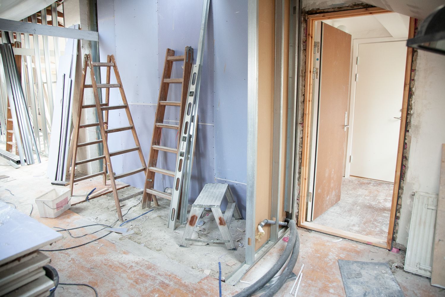 A room mid-project, prepped with a ladder set up