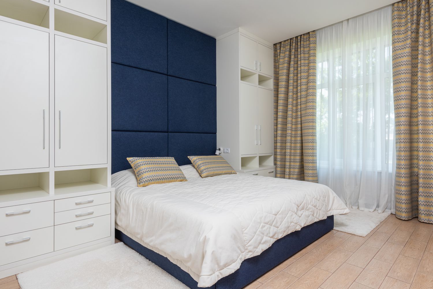 A bold, freshly painted deep-navy feature wall