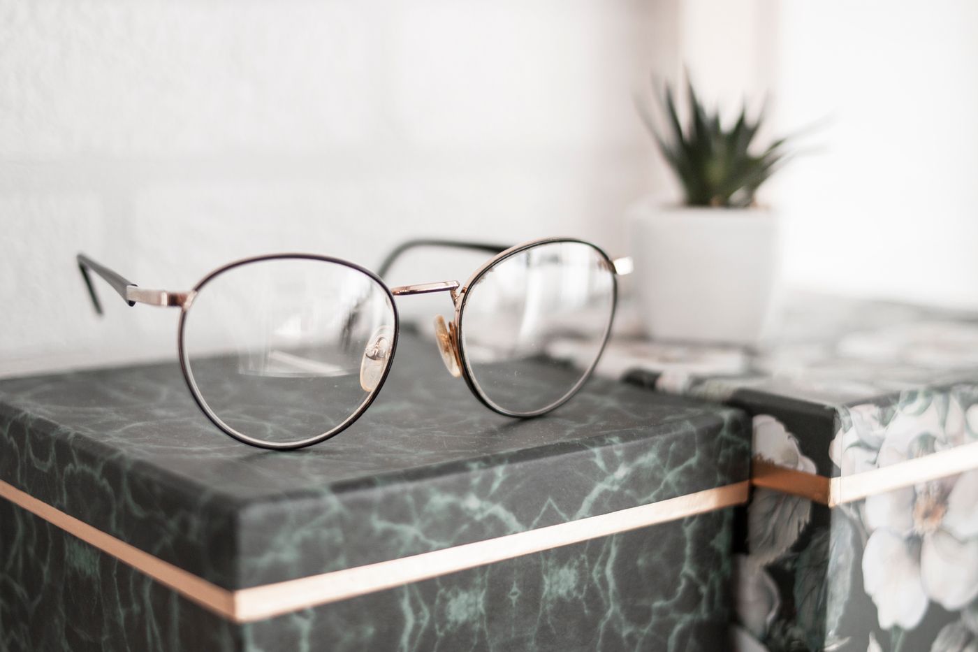 Eyeglass frames resting on a shelf