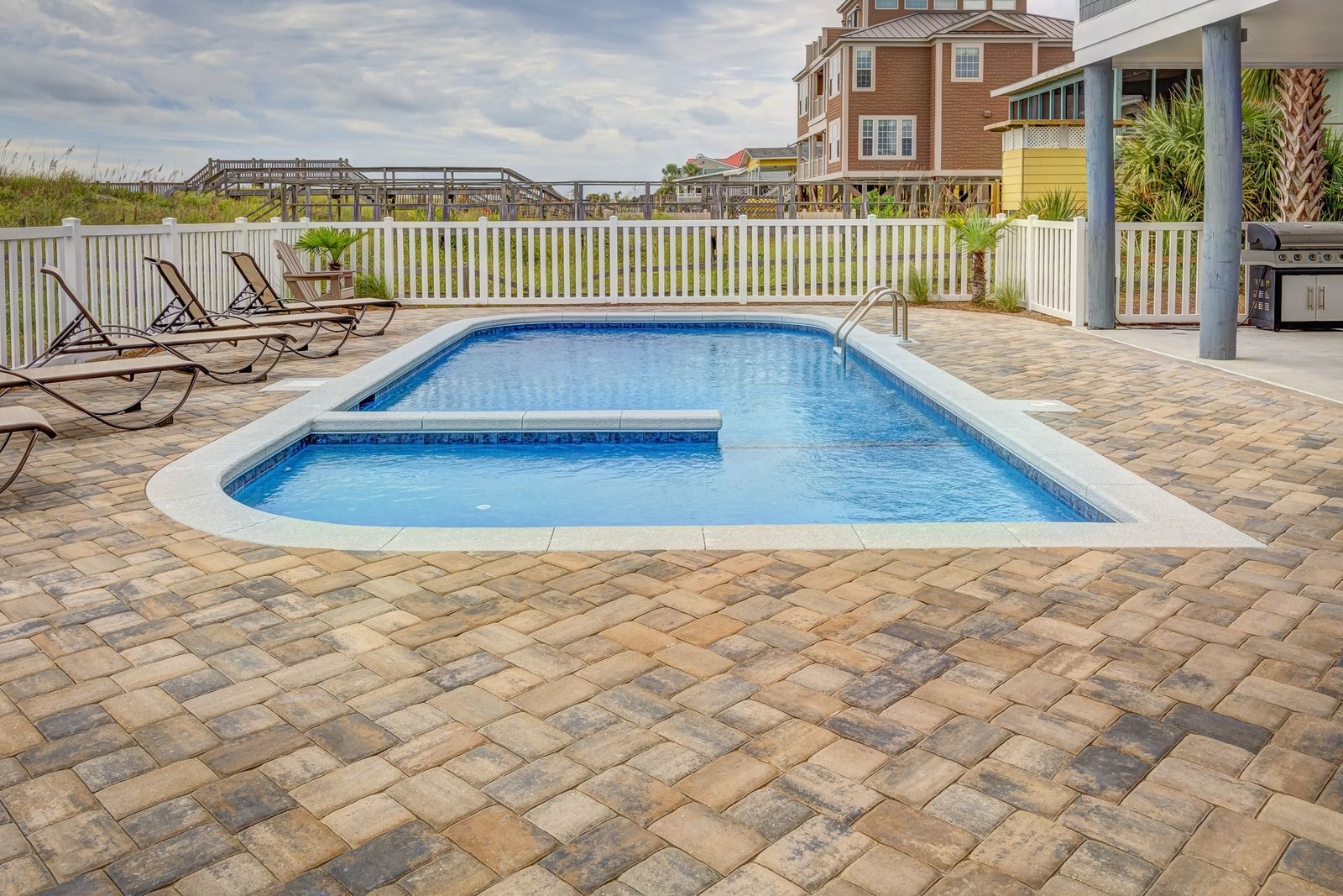 Paver-deck backyard pool and spa